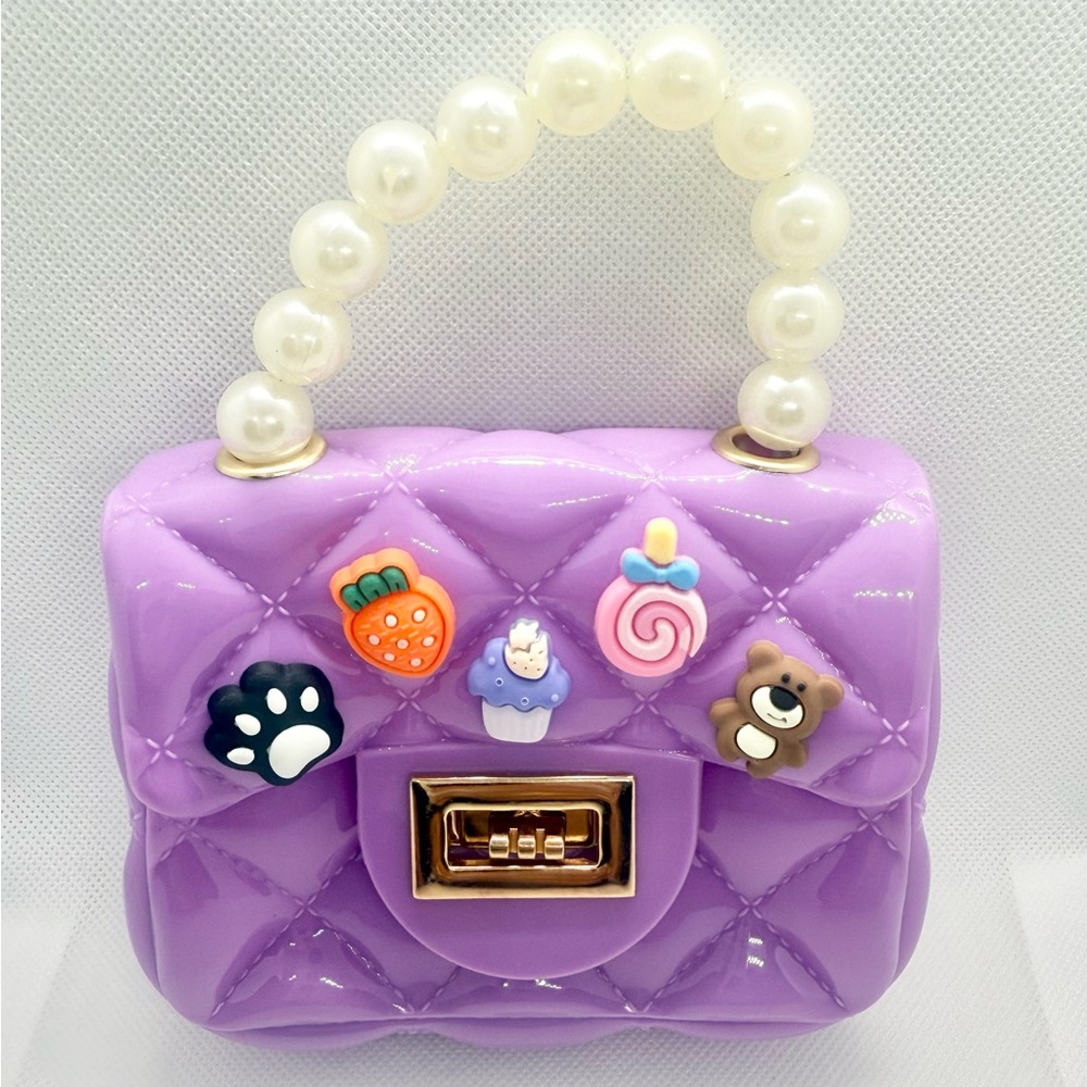 Purple Quilted Handbag with Pearl Handle and a Gold Plated Shoulder Strap.